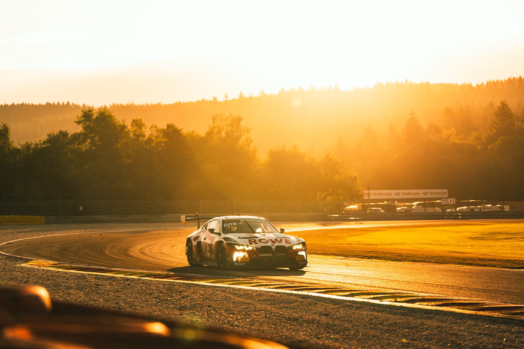 BMW backlit at sunrise at Spa